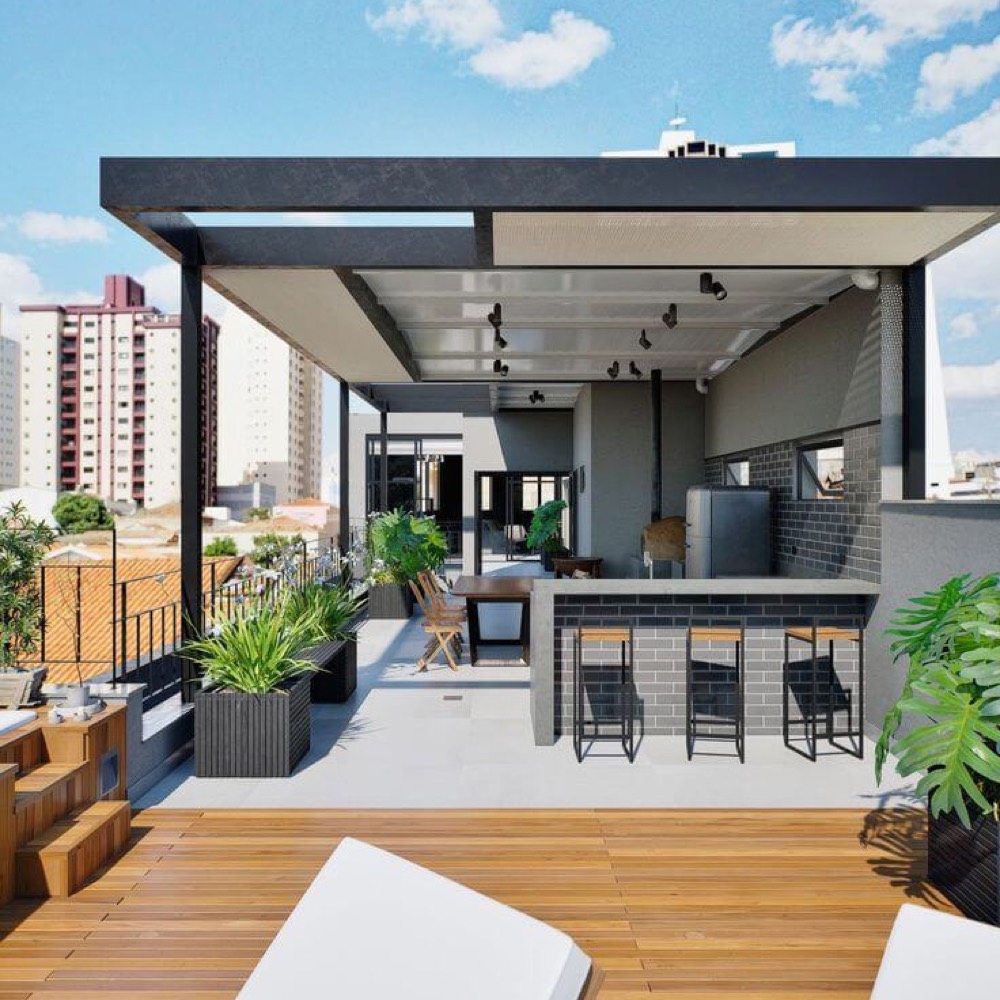 Área gourmet com pérgola metálica e churrasqueira